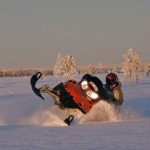 Deep snow snow mobile riding