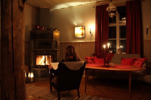 Relaxing by fireplace at Wärdshuset