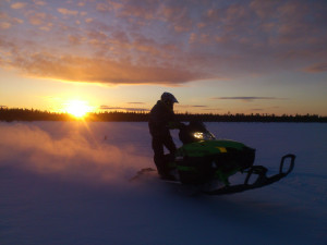 Snowmobile sunset winter